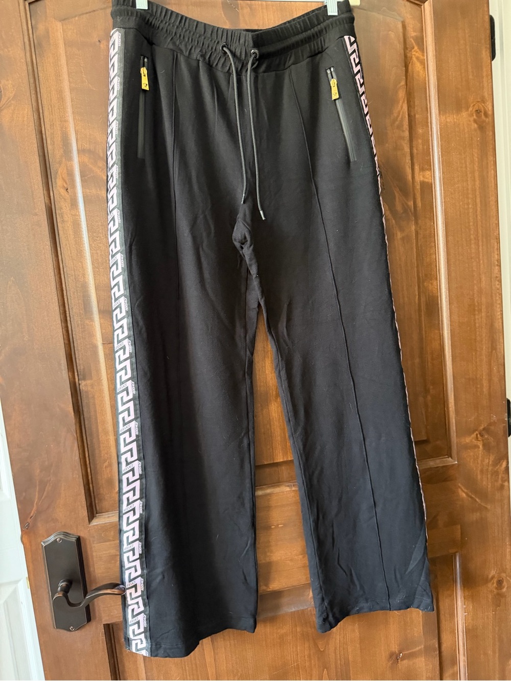 Versace Black Joggers with pink Greek Key Side Trim. Size 46. Like new Very soft